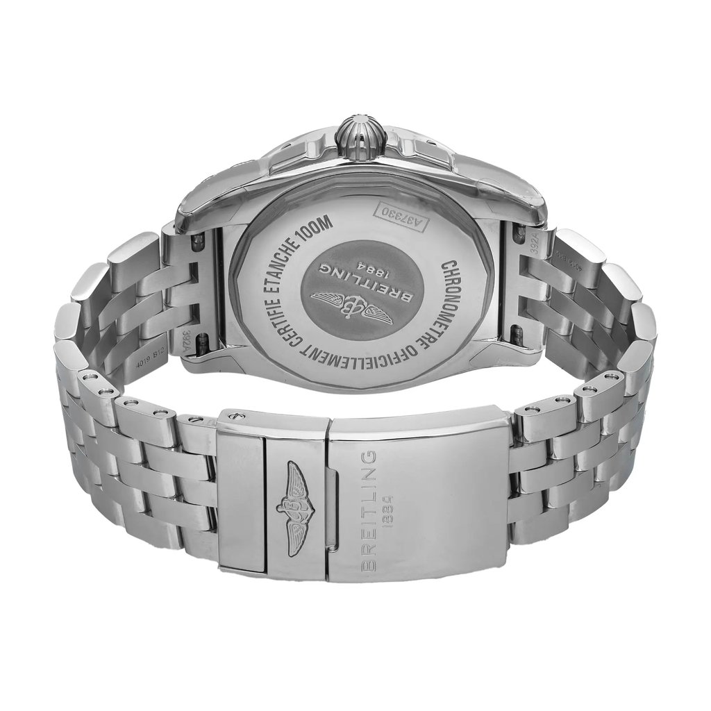 An image of an unworn Breitling women's wristwatch in a close-up back view. The watch features a round stainless steel case with a screwback caseback, engraved with text and the Breitling logo. The stainless steel band has a fold-over clasp with a flip lock safety also displaying the Breitling logo. The watch is positioned at a slight angle, allowing visibility of the band's closure mechanism and the back of the case. The distance from the camera captures the entire back profile of the watch. The watch may show minor blemishes due to store handling.