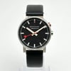 An image of a Wristwatch by Mondaine. This Pre Owned item is designed for Men, featuring a Casual,Classic,Dress/Formal style. It has a Quartz movement and an Analog display with a Black dial color. The indices include 12-Hour Dial,Non-Numeric Hour Marks,Stick Indexes. The band is made of Leather and the case is made of Stainless Steel. The watch has a Round shape with a case size of 40 mm and a case thickness of 12 mm.