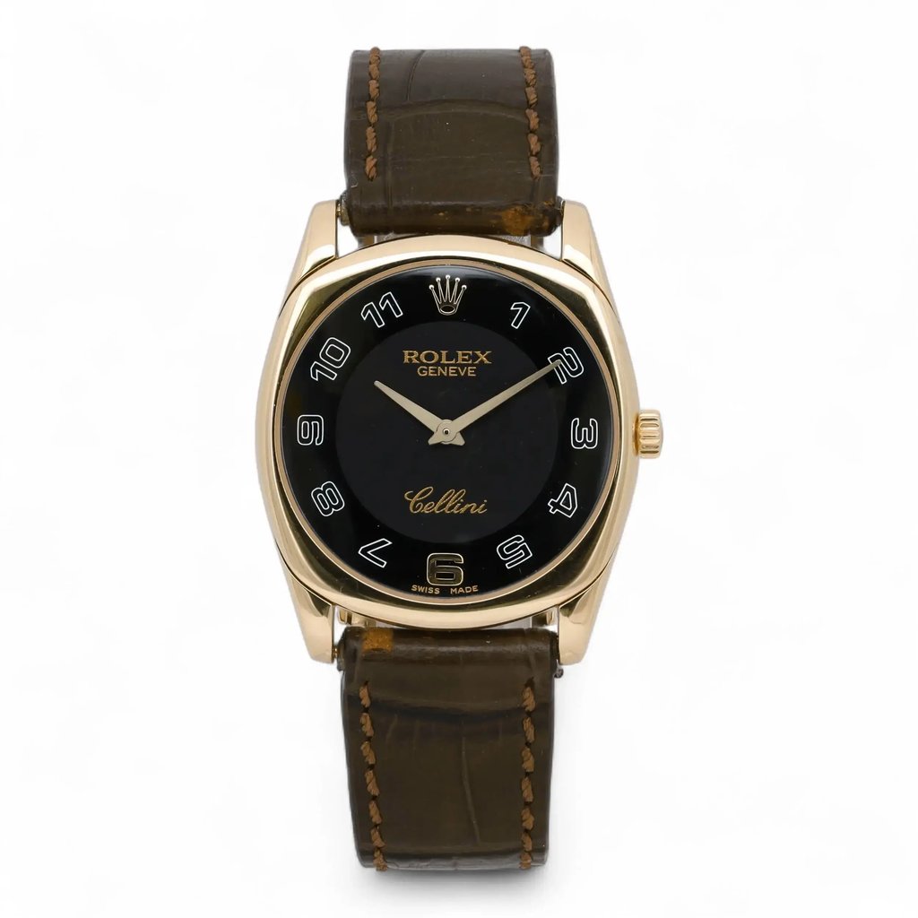An image of a pre-owned men's Rolex Cellini Danaos 33MM 18K Rose Gold Black Dial Manual Wind Men Watch 4233 viewed from a straight-on angle, showcasing its classic design. The watch features a black dial with gold hour markers and hands, encased in a gold frame. The brand name "Rolex" and "Cellini" are displayed prominently on the dial. The watch is attached to a brown leather strap, with visible stitching, and is positioned centrally in the image against a plain white background.