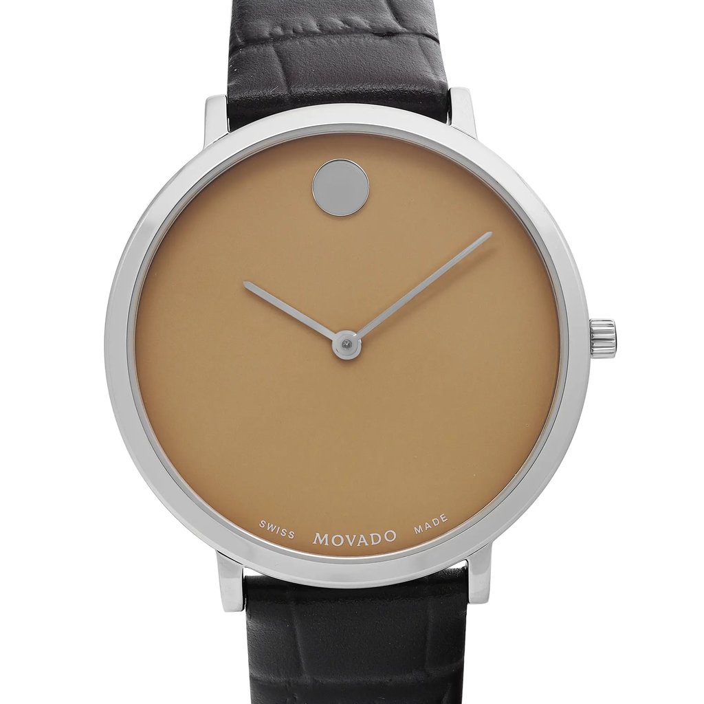 An image of a Wristwatch by Movado. This Display Model item is designed for Women, featuring a Classic style. It has a Quartz movement and an Analog display with a Beige dial color. The indices include 12-Hour Dial,No Hour Marks. The band is made of Leather and the case is made of Stainless Steel. The watch has a Round shape with a case size of 35 mm and a case thickness of 6 mm.