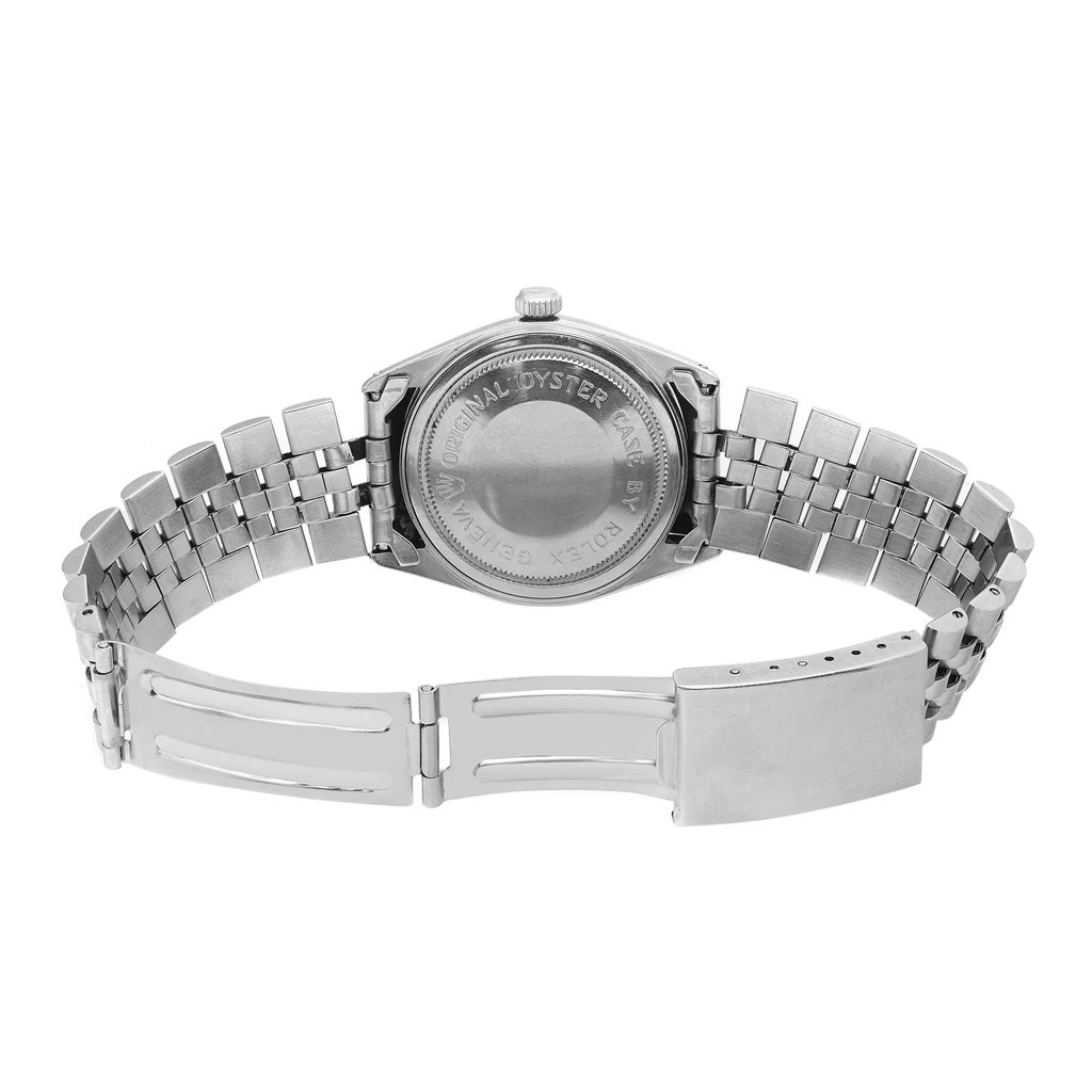 An image of a pre-owned TUDOR men's wristwatch, focusing on the back view. The watch is positioned horizontally, with the stainless steel bracelet fully extended. The case back, featuring engraved text, is at the center of the image, captured at eye level from a close distance. The angle highlights the intricate links of the bracelet and the clasp details.