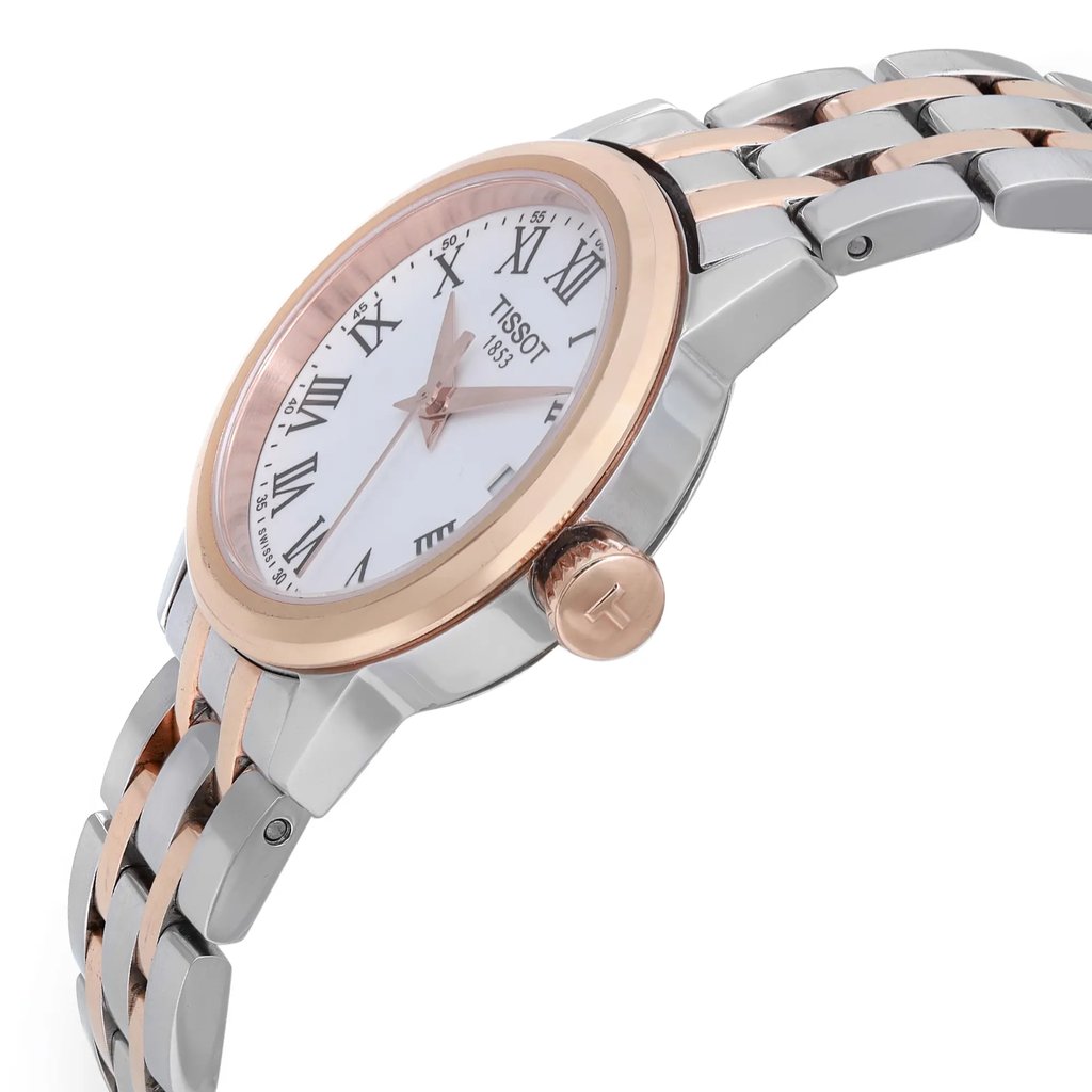 An image of a Wristwatch by Tissot. This Pre Owned item is designed for Women, featuring a Casual style. It has a Quartz movement and an Analog display with a White dial color. The indices include 12-Hour Dial,Roman Numerals. The band is made of Stainless Steel and the case is made of Rose Gold Plated,Stainless Steel. The watch has a Round shape with a case size of 28 mm and a case thickness of 8 mm.