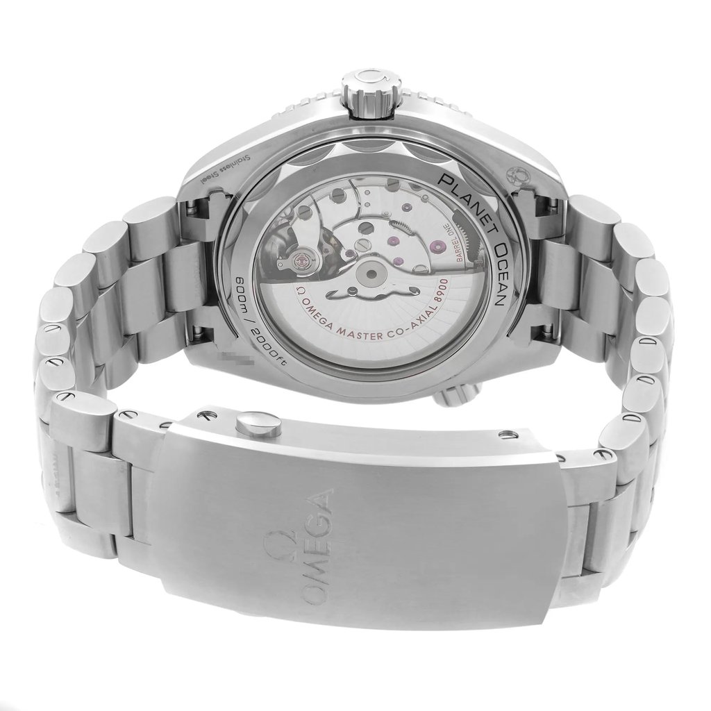 An image of a wristwatch taken from the back view, showcasing the detailed mechanics through a transparent case back. The angle is slightly elevated, providing a clear view of the movement inside. The stainless steel bracelet is prominently displayed, with the clasp closed, featuring the brand's logo engraved on it. The watch appears to be a display model, with pristine and polished surfaces visible in the close-up shot.