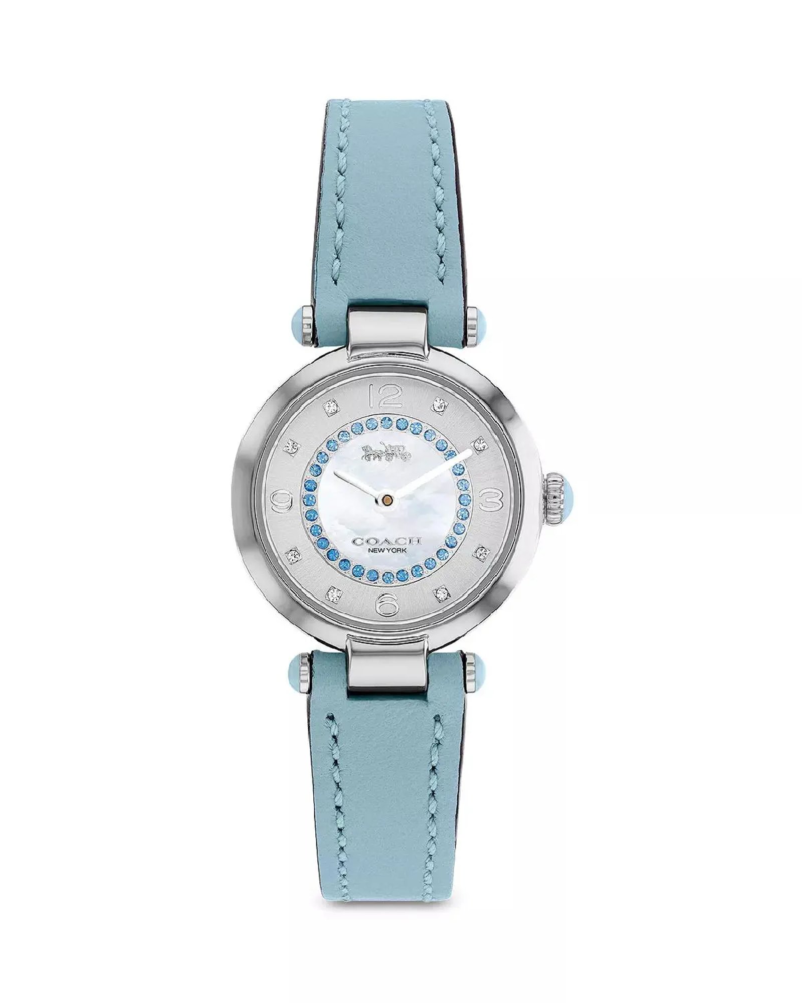 An image of a Wristwatch by Coach. This Pre Owned item is designed for Women, featuring a Dress/Formal style. It has a Quartz movement and an Analog display with a White dial color. The indices include 12-Hour Dial,Arabic Numerals. The band is made of Leather and the case is made of Stainless Steel. The watch has a Round shape with a case size of 26 mm and a case thickness of 8 mm.