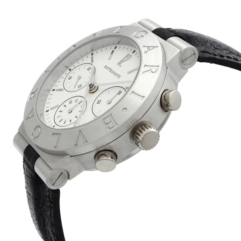 An image of a pre-owned Bvlgari men's wristwatch, featuring a chronograph and small seconds subdial. The watch is positioned at a slight angle, showcasing its platinum case and black leather strap. The photograph is taken from a close distance, emphasizing the engraved Bvlgari branding on the bezel and the watch's side profile, including the crown and pushers.