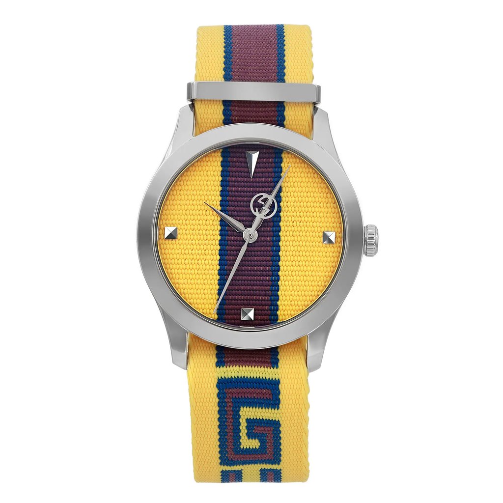 An image of a Wristwatch by Gucci. This Unworn item is designed for Unisex Adult, featuring a Casual style. It has a Quartz movement and an Analog display with a Yellow dial color. The indices include 12-Hour Dial,Non-Numeric Hour Marks. The band is made of Nylon and the case is made of Stainless Steel. The watch has a Round shape with a case size of 38 mm and a case thickness of 9.5 mm.