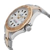 An image of a pre-owned wristwatch captured from a side profile view, showcasing the crown prominently. The watch features a two-tone design with a gold bezel and stainless steel case. The angle highlights the face with its clear markings and the distinctive brand logo. The bracelet is partially visible, displaying its dual-tone links, and the watch is positioned at a slight upward angle.