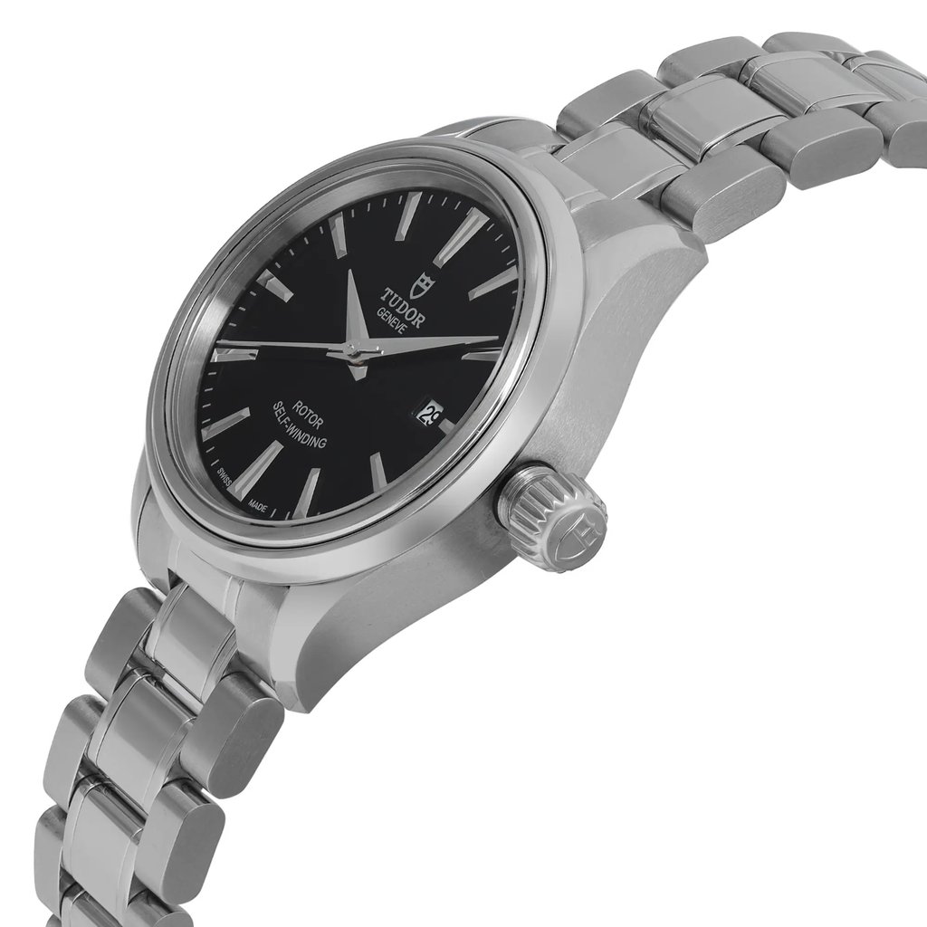 An image of a wristwatch in an unworn condition, shown from a side profile view. The focus is on the watch's crown, which is prominently visible. The angle highlights the sleek metal bracelet and the black watch face with silver hour markers. The photo captures the watch at a moderate distance, emphasizing its design details and craftsmanship.