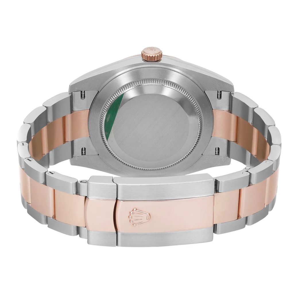 An image of a pre-owned Rolex men's wristwatch, viewed from the back showing the screwback case and closed fold-over clasp. The watch is positioned centrally and photographed at a close distance, capturing the entire back view. The stainless steel caseback is round with minor scratches visible, and a sticker is present. The band is composed of alternating links of stainless steel and rose gold. The Rolex crown logo is embossed on the clasp, and the watch is angled to display the band's profile and closure mechanism.