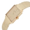 An image of a pre-owned Patek Philippe wristwatch, designed for unisex adults. The watch is positioned at a slight angle, showcasing its rectangular face and the textured band. The crown is prominently visible on the right side. The watch is photographed up close, highlighting its elegant design and detailing.