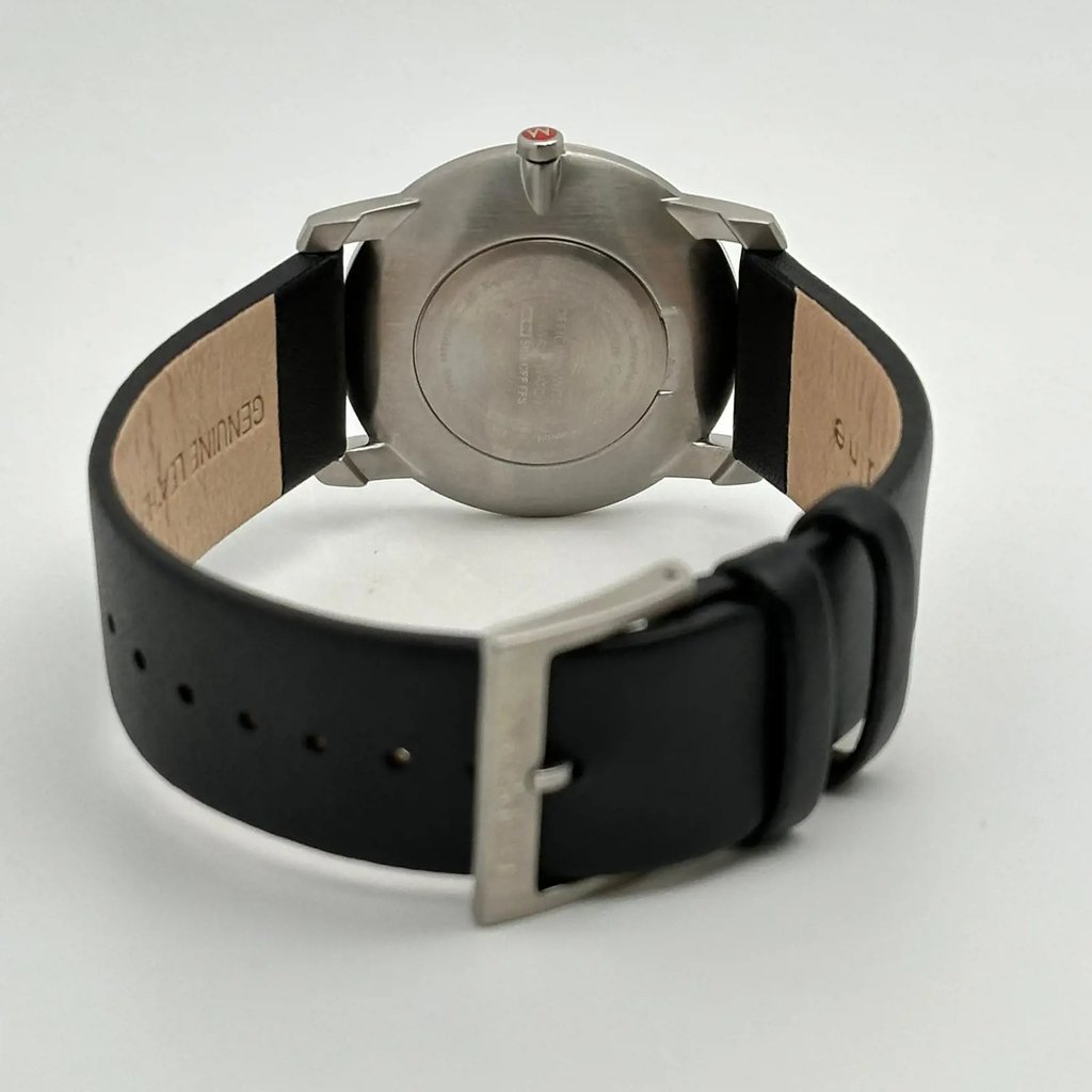 Back View Of Snap Back Case And Closed Leather Band Of Mondaine A672.30351.14SBB Watch Display Model Condition