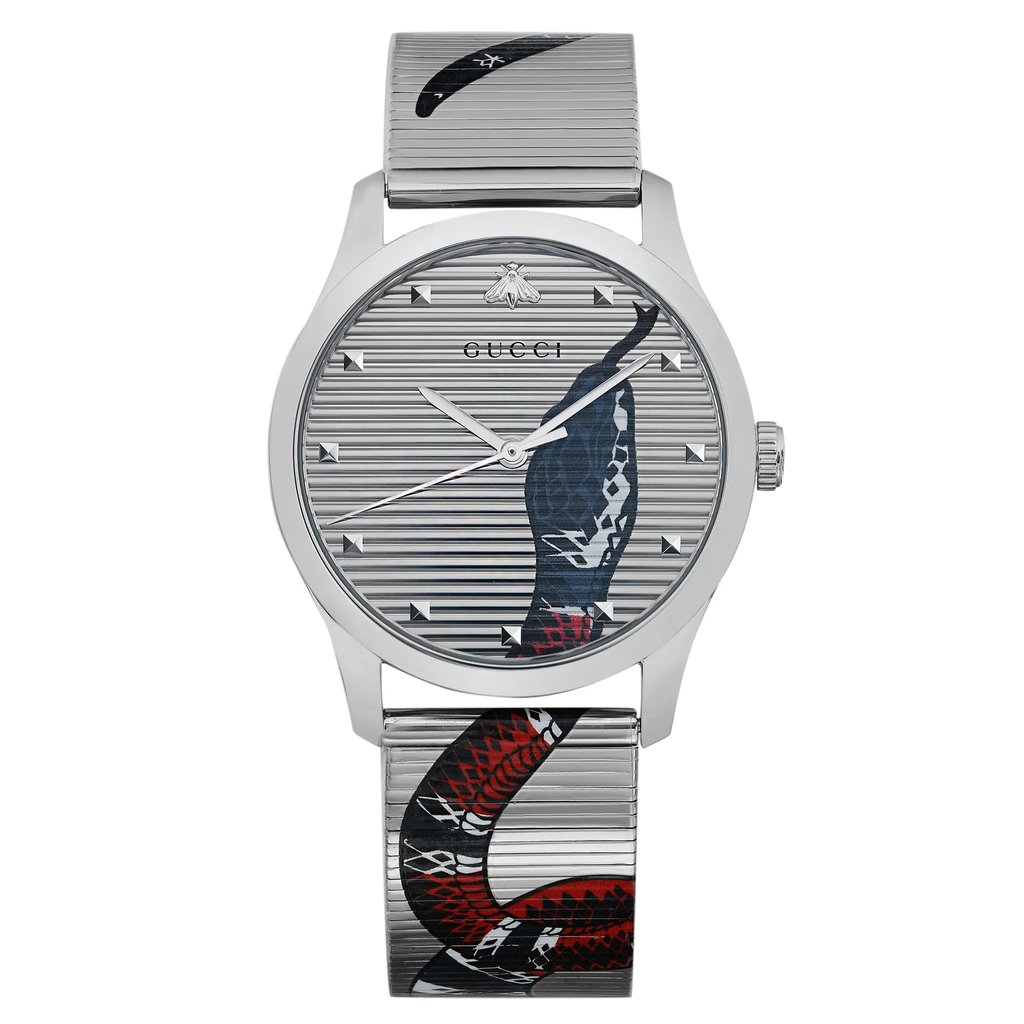 An image of an unworn Gucci wristwatch positioned directly facing the camera, offering a complete frontal view. The watch showcases a casual style with a round stainless steel case and band. Its silver dial features an animal print pattern, specifically a snake design that extends from the dial onto the band. The watch has a 12-hour dial with indices and the Gucci logo at the top. The image is taken from a close, yet fully encompassing distance, ensuring the entire watch is visible and in focus.