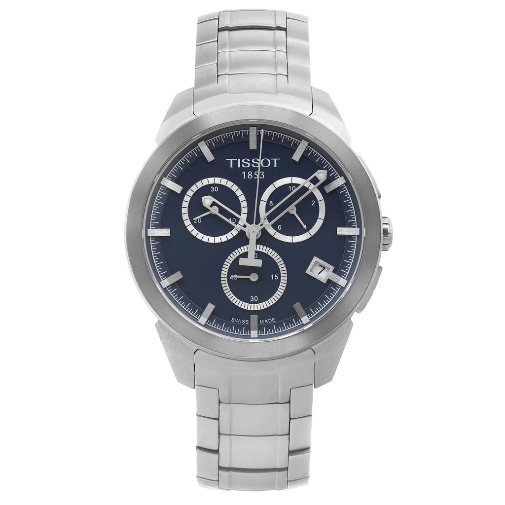 An image of a Wristwatch by Tissot. This Pre Owned item is designed for Men, featuring a Casual style. It has a Quartz movement and an Analog display with a Blue dial color. The indices include 12-Hour Dial,Stick Indexes. The band is made of Titanium and the case is made of Titanium. The watch has a Round shape with a case size of 43 mm and a case thickness of 11 mm.