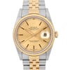 An image of a pre-owned men's Rolex wristwatch, viewed from a straight-on angle at close range. The watch features a two-tone metal bracelet with a gold and stainless steel. The gold dial includes a date indicator at the 3 o'clock position and luminous hands. The brand's logo and model details are visible on the face, framed by a gold bezel.
