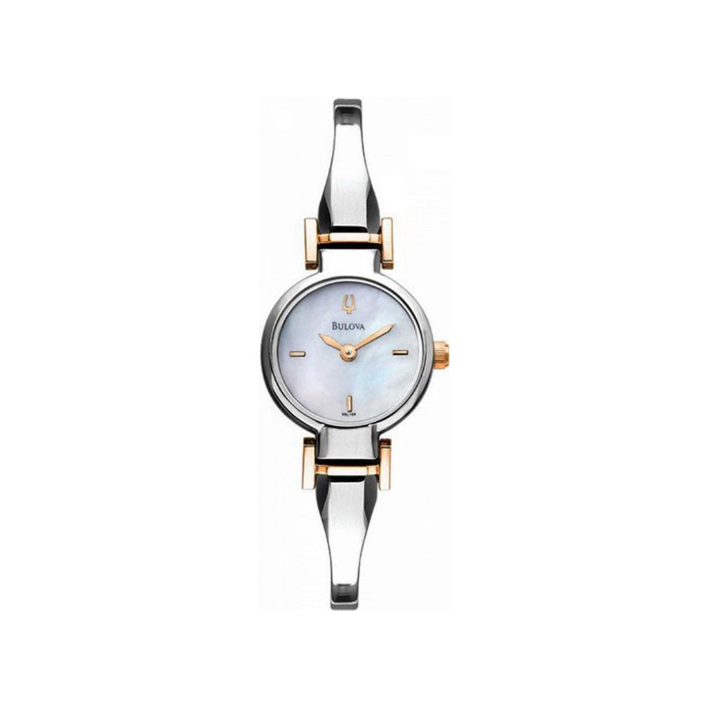 An image of a pre-owned Bulova women's dress/formal wristwatch, presented in a full frontal view. The watch features a round case and a white mother of pearl dial with stick indexes, framed by a steel bezel. It has a stainless steel band with gold-tone accents.