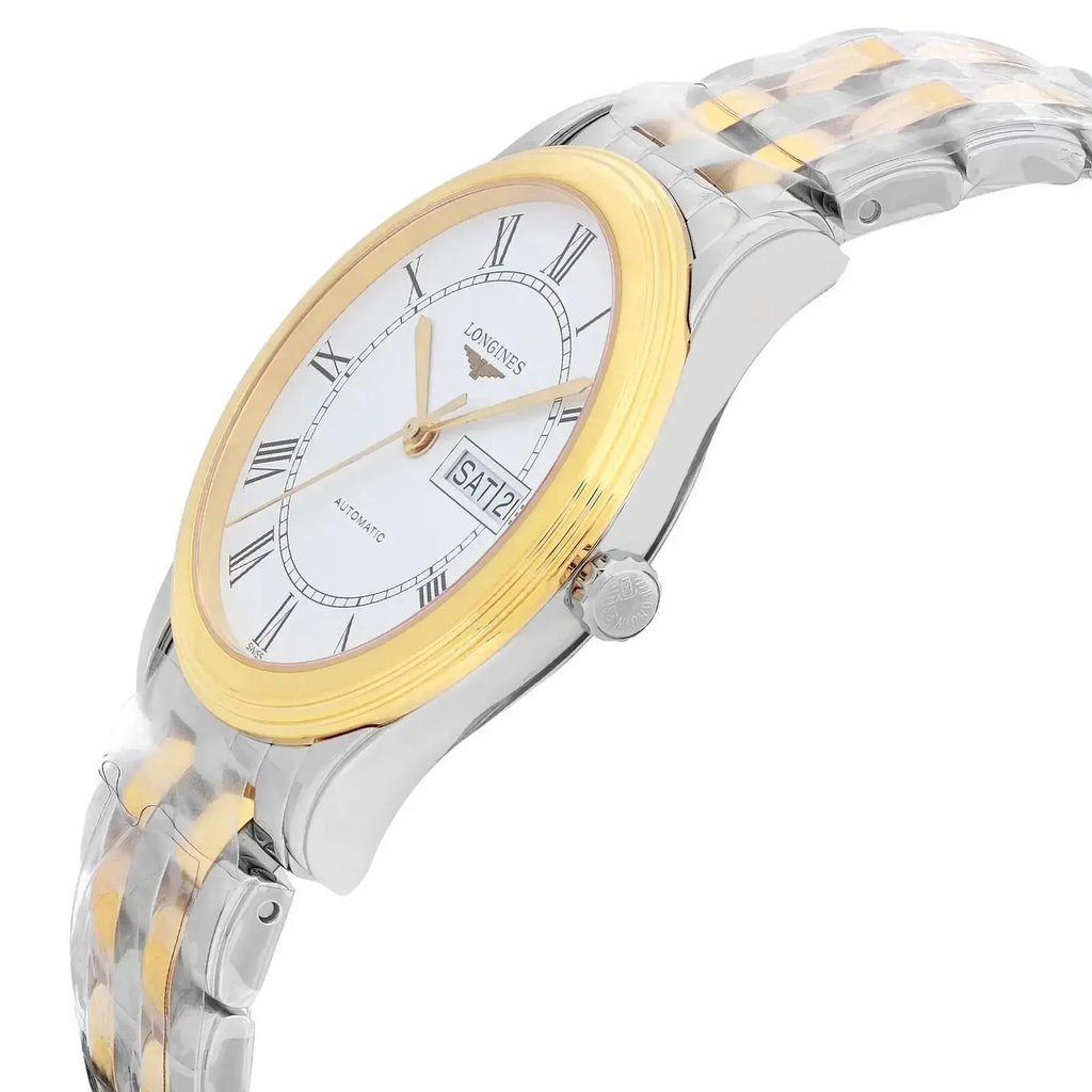 An image of a new wristwatch captured from a side profile view, highlighting the crown on the right side. The watch features a two-tone bracelet and a round face with a gold-tone bezel. Roman numerals are visible on the white dial, along with the day and date display. The angle emphasizes the sleek design and metallic finish, showcasing the watch from a close distance.