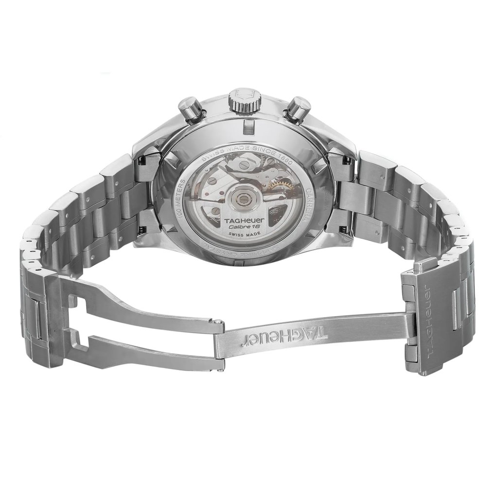 An image of a pre-owned TAG Heuer men's wristwatch, viewed from the back with an open clasp, positioned horizontally. The watch features an exhibition caseback displaying the internal mechanism, a stainless steel case and band, and a round shape. The fold-over clasp with double push-button release is visible and slightly open. The back of the watch is etched with the brand name and other details, indicating its Swiss-made heritage. The photograph is taken at a close distance, with a direct angle that provides a clear view of the watch's features. Minor blemishes may be present due to handling and shipping.