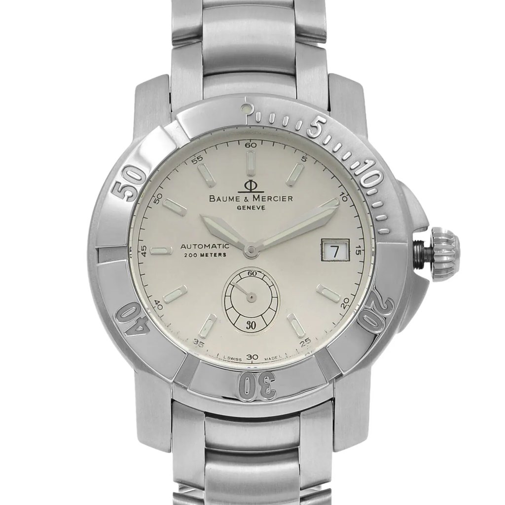 An image of a pre-owned wristwatch taken from a front close-up angle, showcasing the watch face in detail. The watch features a metallic band and a round dial with a date display on the right side. The bezel has engraved numerals marking intervals. The brand name is visible on the dial.