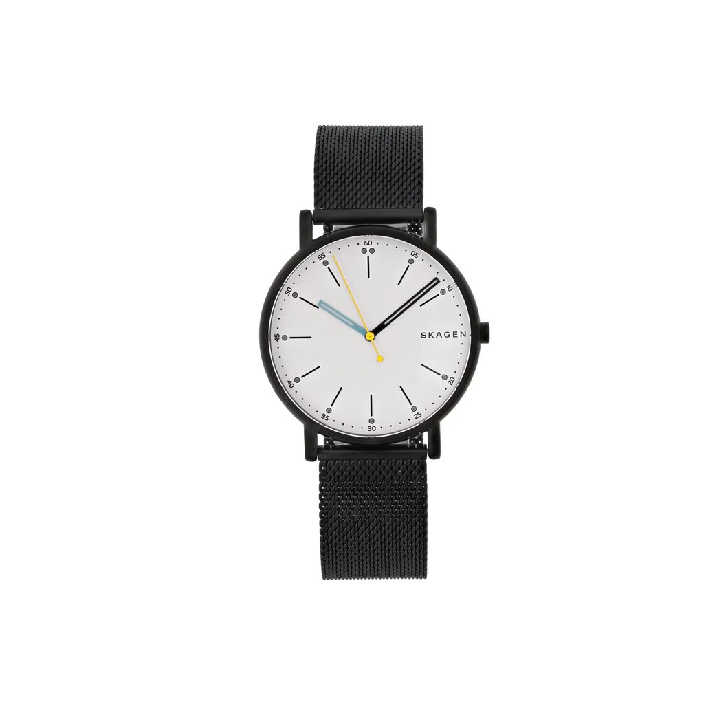 An image of a Skagen women's wristwatch, displayed as a model. The watch is positioned upright, directly facing the viewer, providing a clear frontal view. The angle is straight on, showcasing the full design of the watch face and strap. The photograph is taken from a close distance, highlighting the black mesh strap, minimalist white dial, and the contrasting yellow and blue hands.
