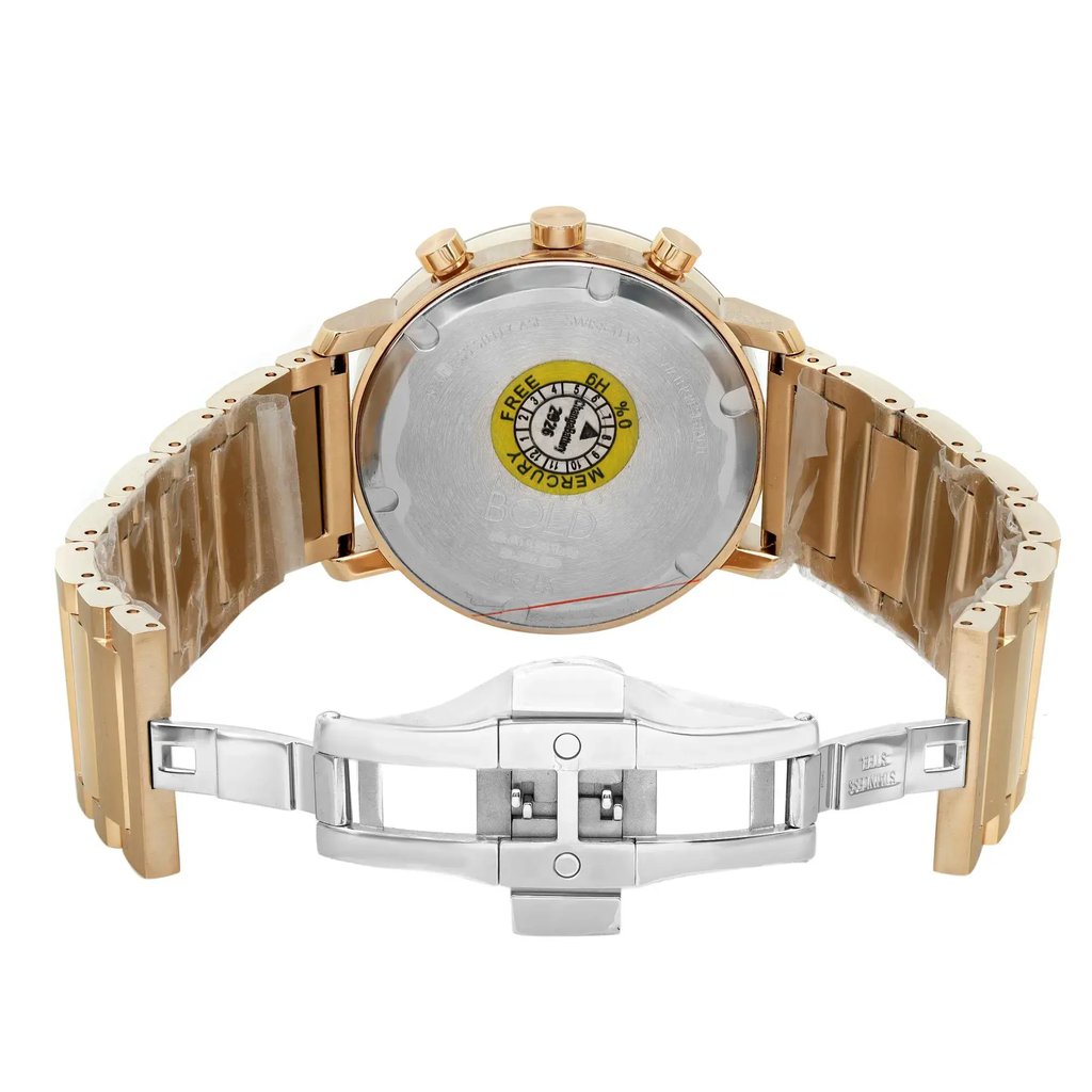 An image of a pre-owned wristwatch taken from the back view, showing the open clasp. The watch is positioned at a slight angle, with the metal bracelet unfolded, displaying its interior side. The focus is on the watch's back case and the opened clasp, highlighting the details from a moderate distance. The watch features a mix of metallic tones.