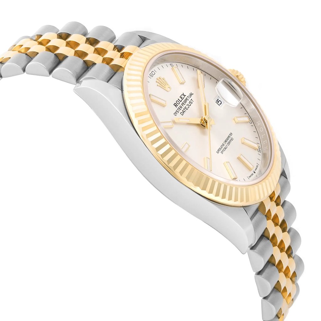 An image of an unworn men's Rolex wristwatch in excellent condition, featuring a luxury style with a round shape. The watch is presented in a side profile view opposite of the crown, showcasing a silver dial and a yellow gold bezel. The band is composed of stainless steel and yellow gold in a two-tone pattern, and the case material is stainless steel. The watch is positioned at a close distance, capturing the details and angles of the side profile distinctly.