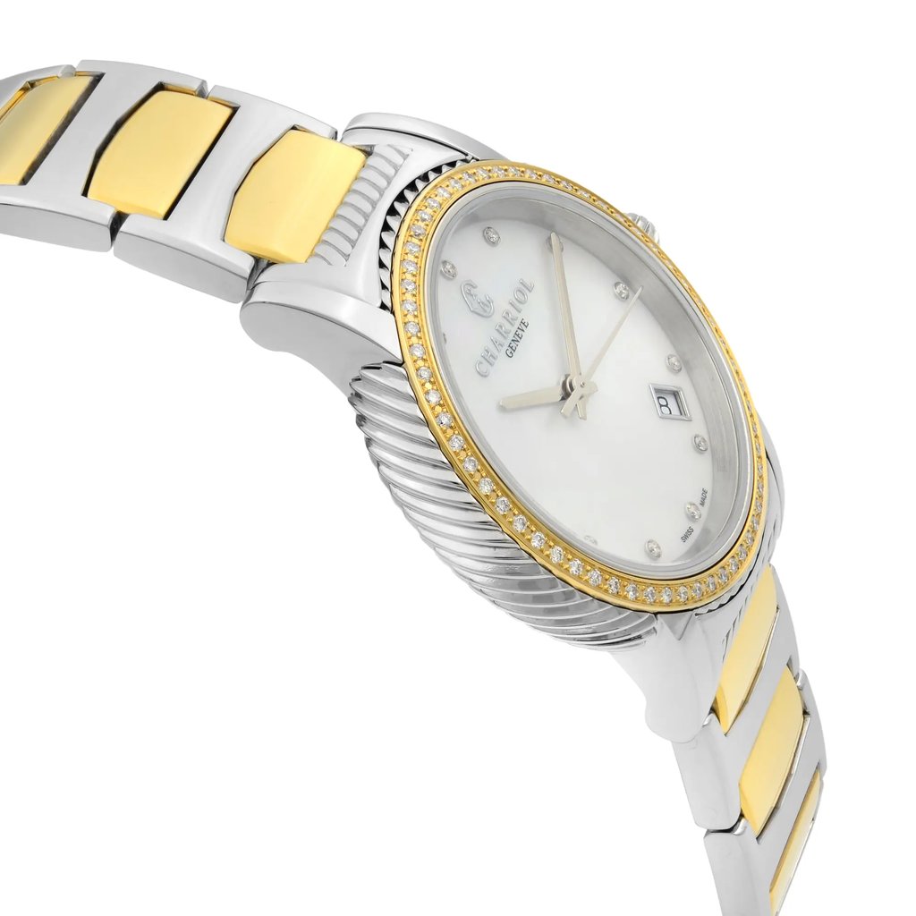 An image of a pre-owned wristwatch viewed from the side profile, opposite the crown. The angle highlights the sleek design of the watch case and the two-tone metal bracelet. The watch face is partially visible, displaying a date feature and ornate detailing around the bezel. The photograph captures the watch from a close distance, showcasing its elegant craftsmanship and intricate details.