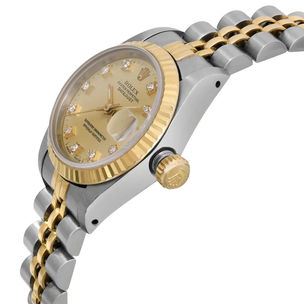 An image of a pre-owned wristwatch shown from a side profile view, highlighting the crown. The watch features a gold and silver-toned metal bracelet and a gold bezel. The angle emphasizes the textured crown and the details on the watch face, which include hour markers and hands. The image is taken at a close distance, focusing on the watch's craftsmanship and condition.