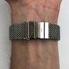 Back View Of {Caseback} Back Case And Closed Stainless Steel Band Of Breitling AB141112/G799-154A Watch Display Model Condition