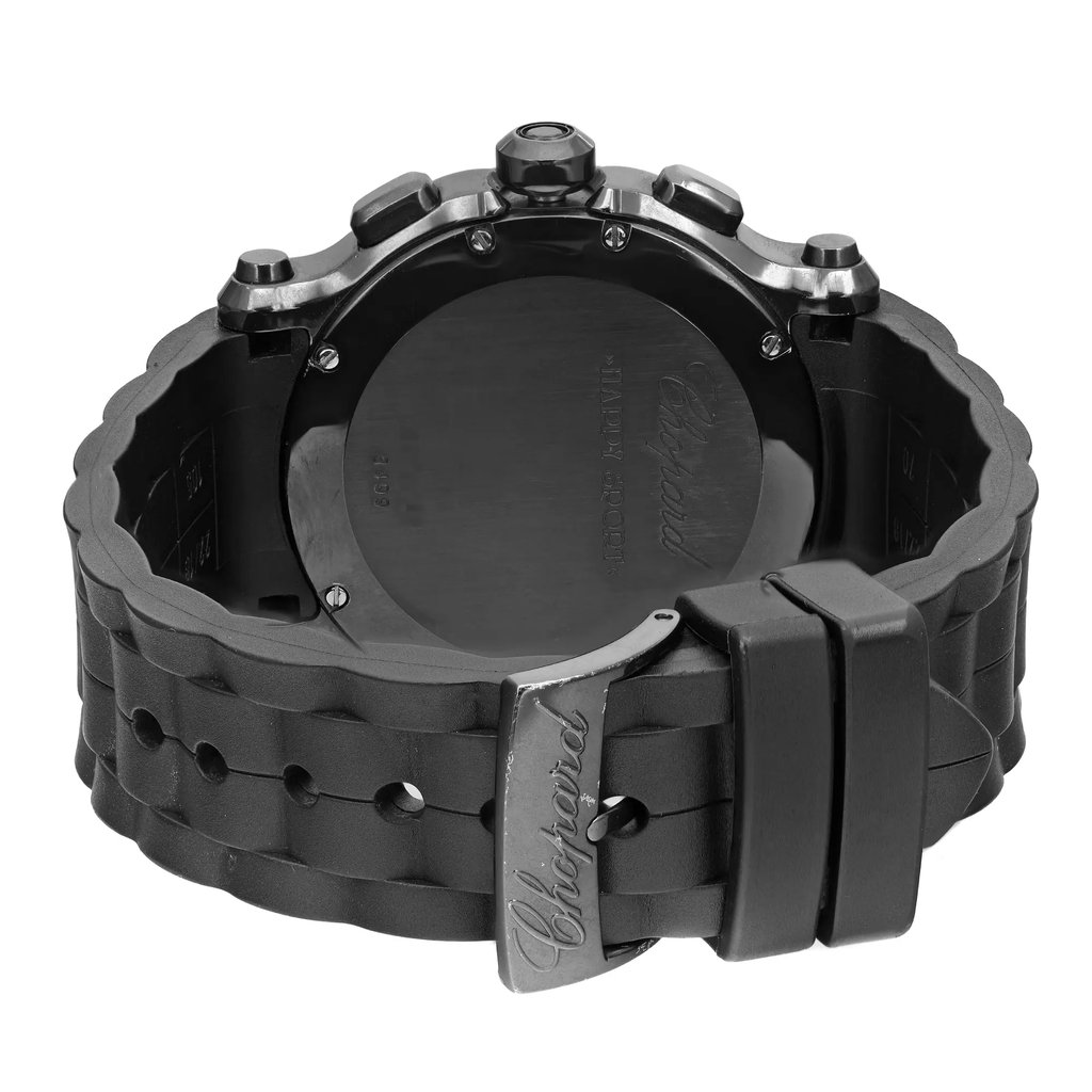 An image of a Wristwatch by Chopard. This Pre Owned item is designed for Unisex Adult, featuring a Casual style. It has a Quartz movement and an Analog display with a Black dial color. The indices include 12-Hour Dial,Roman Numerals,Stick Indexes. The band is made of Rubber and the case is made of Stainless Steel. The watch has a Round shape with a case size of 41 mm and a case thickness of 13 mm.