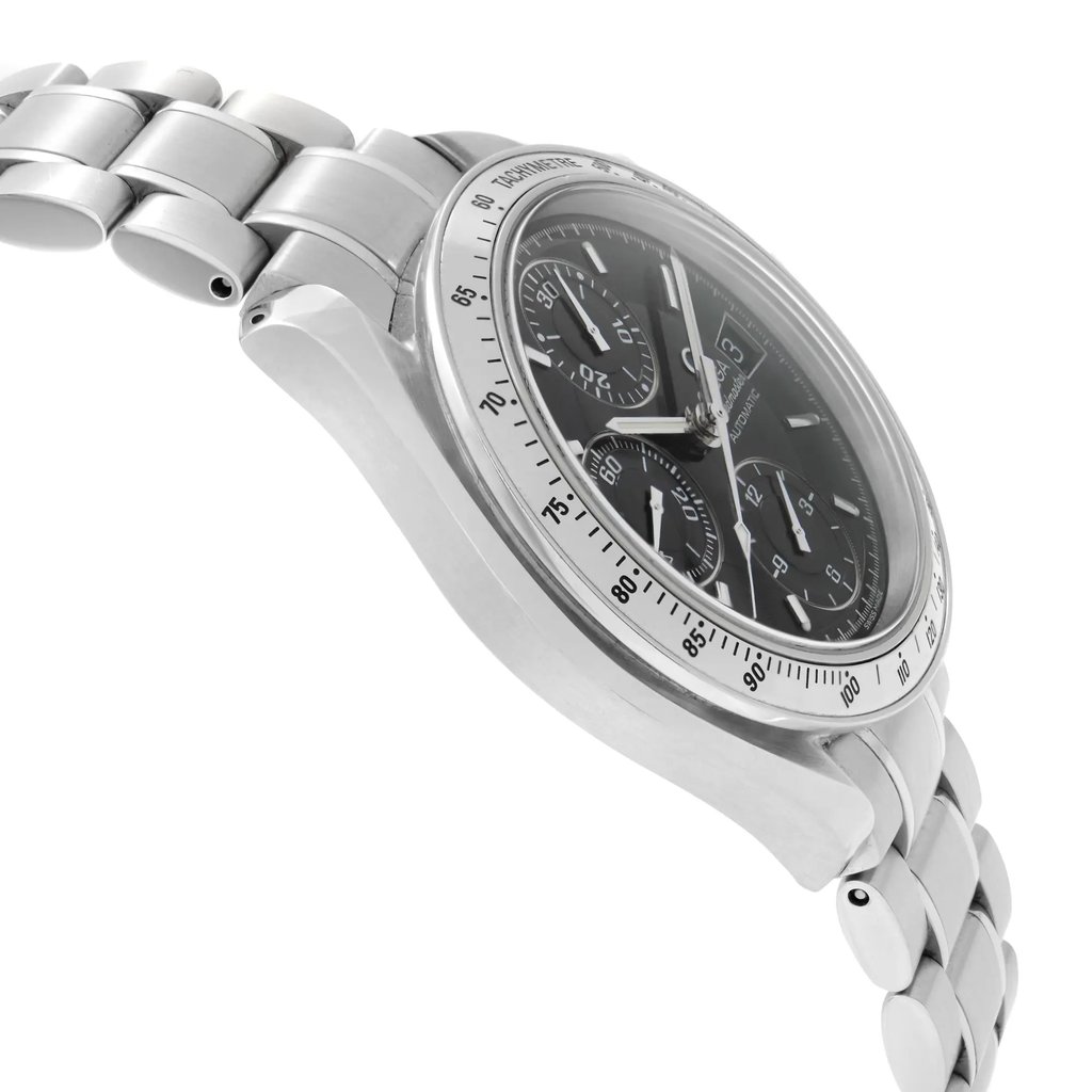 An image of a pre-owned wristwatch showing a side profile view opposite the crown. The watch features a stainless steel bracelet and a round case with a black dial and multiple subdials. The angle highlights the sleek design and tachymeter markings on the bezel. The photograph is taken from a close-up perspective, emphasizing the watch’s intricate details and craftsmanship.