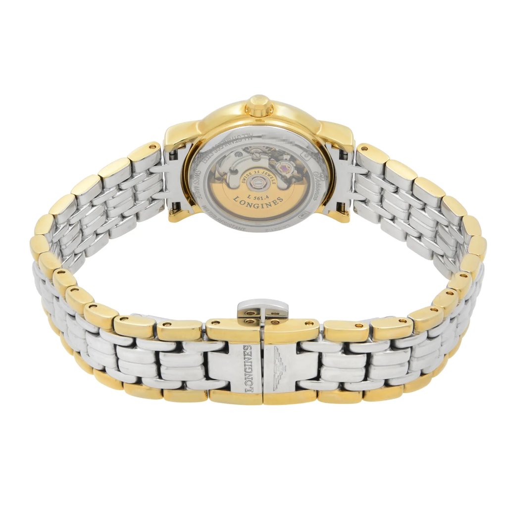 An image of a wristwatch showcasing its back view at a close distance. The watch features a two-tone metal bracelet with gold and silver links. The clasp is prominently displayed in the foreground, engraved with a logo. The watch's back reveals its internal mechanism, visible through a transparent case. The angle provides a clear view of the intricate design and craftsmanship.