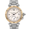 An image of a pre-owned Cartier men's wristwatch taken from a front-facing angle. The watch features a round face with a gold-toned bezel, displaying black numerals at the 12, 3, 6, and 9 o'clock positions. It includes a date indicator at the 4 o'clock position and luminous hands. The stainless steel bracelet is partially visible, and the watch crown is positioned on the right side. The photo captures the watch in close-up, emphasizing its elegant details and design features.