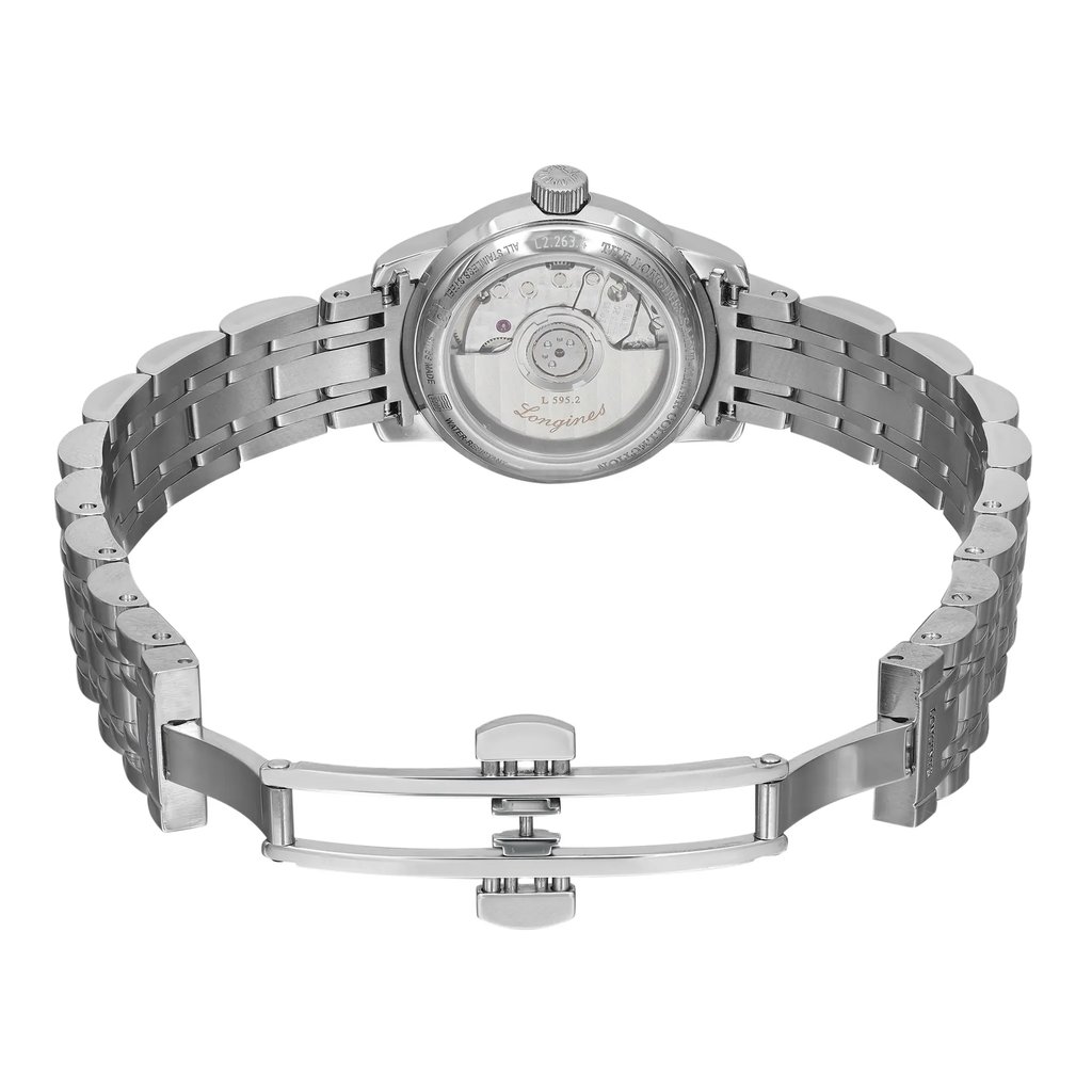 An image of a pre-owned wristwatch taken from the back view, showcasing the open clasp. The watch is positioned centrally with its metal bracelet laid out horizontally, displaying the intricate details of the watch's back, including the visible movement through a transparent case. The angle captures the watch from a slightly elevated perspective, providing a clear view of the open clasp mechanism at close range.