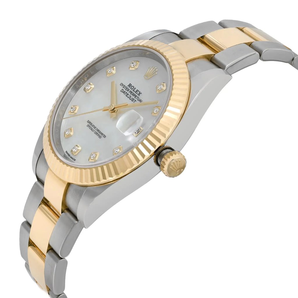 An image of a pre-owned wristwatch viewed from the side profile. The watch is angled slightly upward, showcasing the crown prominently. The case features a combination of gold and silver tones, with a fluted bezel and a bracelet that alternates between these colors. The dial is adorned with diamond hour markers and gold hands, complemented by a date window. The photograph is taken at a close distance, highlighting the watch's luxurious details.