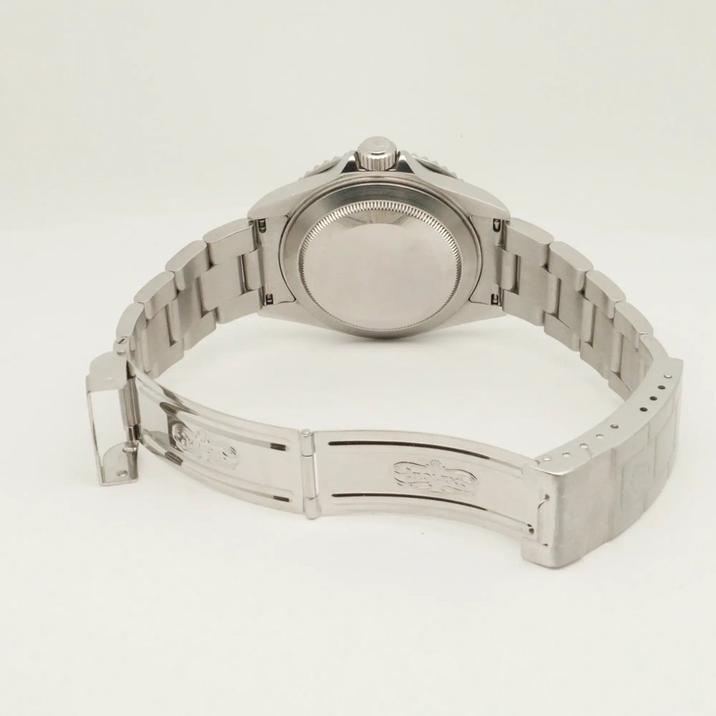 Back View Of Screwback Back Case And Open Stainless Steel Band Of Rolex 16610V Watch Pre Owned Condition