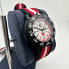An image of a Wristwatch by Luminox. This Pre Owned item is designed for Men, featuring a Casual,Classic,Diver,Dress/Formal,Military style. It has a Quartz movement and an Analog display with a White dial color. The indices include 12-Hour Dial,Arabic Numerals,Easy to Read/Large Numerals. The band is made of Nylon and the case is made of Carbon. The watch has a Round shape with a case size of 43 mm and a case thickness of 10 mm.