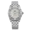An image of an unworn Breitling women's luxury wristwatch, presented in a full frontal view. The watch features a round stainless steel case with a gray bezel and a white mother of pearl dial. The dial showcases diamond markers and luminous hands, a date indicator at the 3 o'clock position, and the Breitling logo. It has a 12-hour dial display and is attached to a stainless steel band. The original protective sticker is visible on the case, indicating its excellent condition.