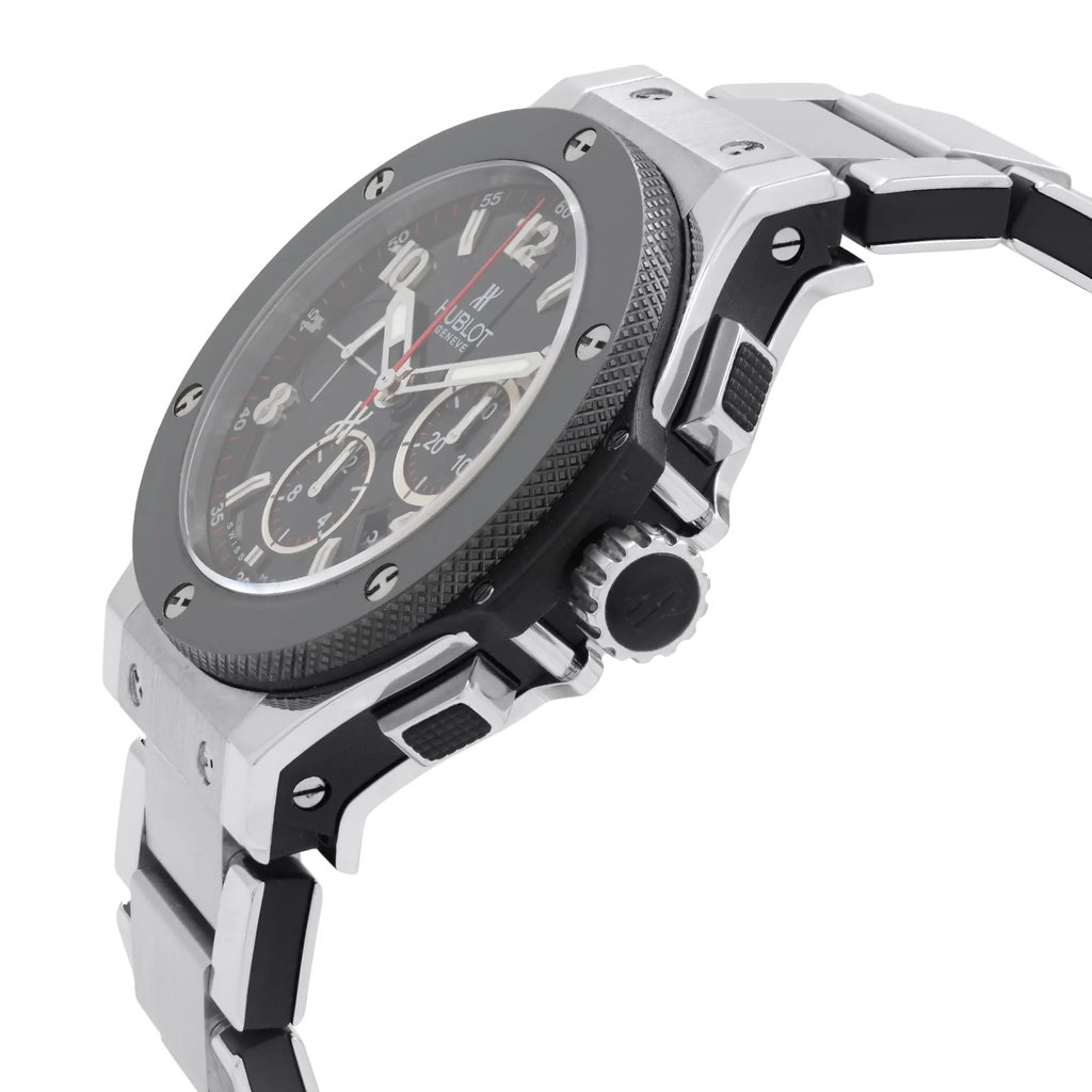 An image of a pre-owned wristwatch shown from a side profile view. The focus is on the crown, which is prominently visible. The watch has a sleek metal case and a black textured bezel. The bracelet is made of polished metal links. The angle highlights the watch's intricate design details, showcasing both functionality and style.