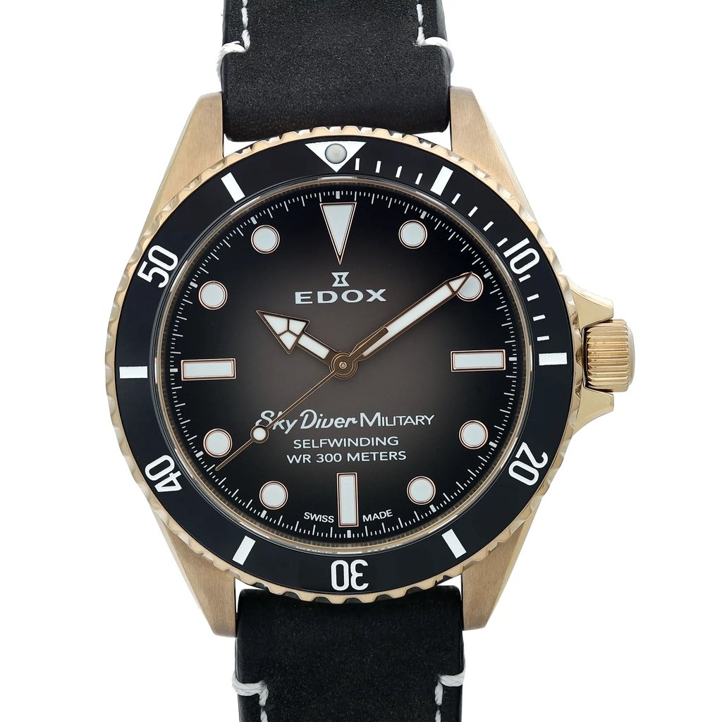 An image of a wristwatch taken from a front close-up angle, showcasing the watch face. The watch features a dark dial with bold, contrasting hour markers and hands, and the words "Sky Diver Military," "Selfwinding," and "WR 300 Meters" inscribed on it. The bezel is marked with numerals at intervals. The watch strap is visible at the top and bottom, highlighting its sturdy build and stitching detail.