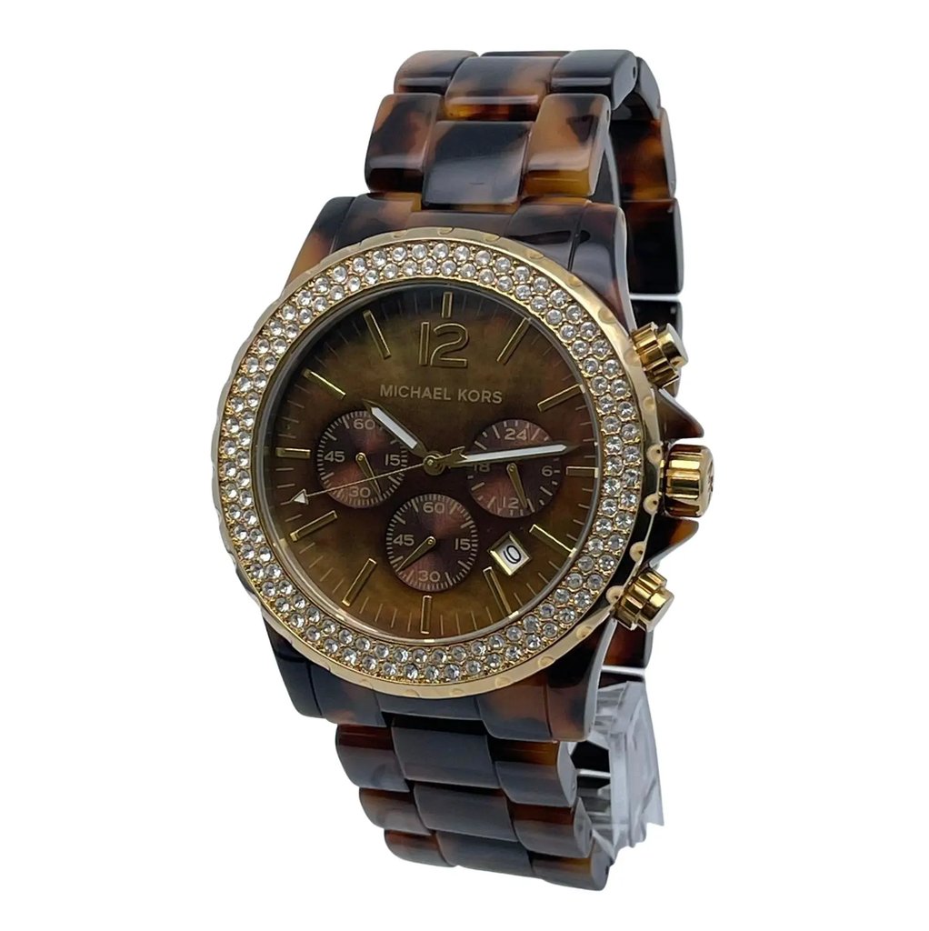 An image of a Wristwatch by Michael Kors. This Pre Owned item is designed for Unisex Adult, featuring a Casual style. It has a Quartz movement and an Analog display with a Brown Mother of Pearl dial color. The indices include 12-Hour Dial,Non-Numeric Hour Marks. The band is made of Acrylic and the case is made of Stainless Steel. The watch has a Round shape with a case size of 45 mm and a case thickness of 13 mm.