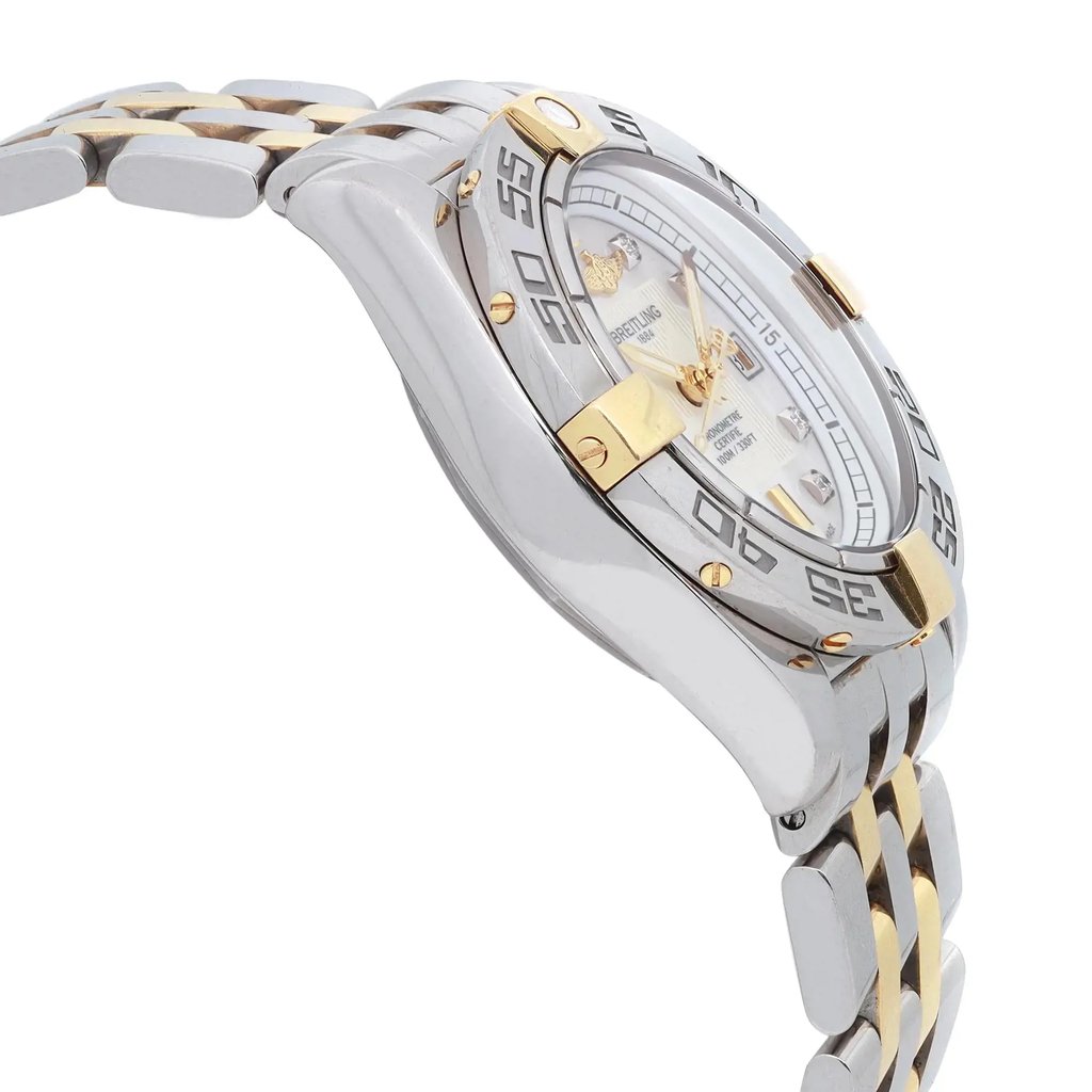 An image of a pre-owned Breitling women's luxury wristwatch. The side profile view is captured from the angle opposite the crown, showing the curvature of the case and the integration of the stainless steel and yellow gold band. The watch has a round shape with a white mother of pearl dial and steel bezel. The band material is a combination of stainless steel and yellow gold, while the case material is stainless steel. The image is taken from a close distance, focusing on the side and part of the watch face. The watch is pre-owned and may show minor signs of wear.