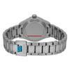 An image of a wristwatch shown from the back view, focusing on the closed clasp. The watch is unworn and has a polished metal bracelet. The clasp displays the brand name "TUDOR." The image is taken at a close distance, highlighting the details of the bracelet links and the watch case back.