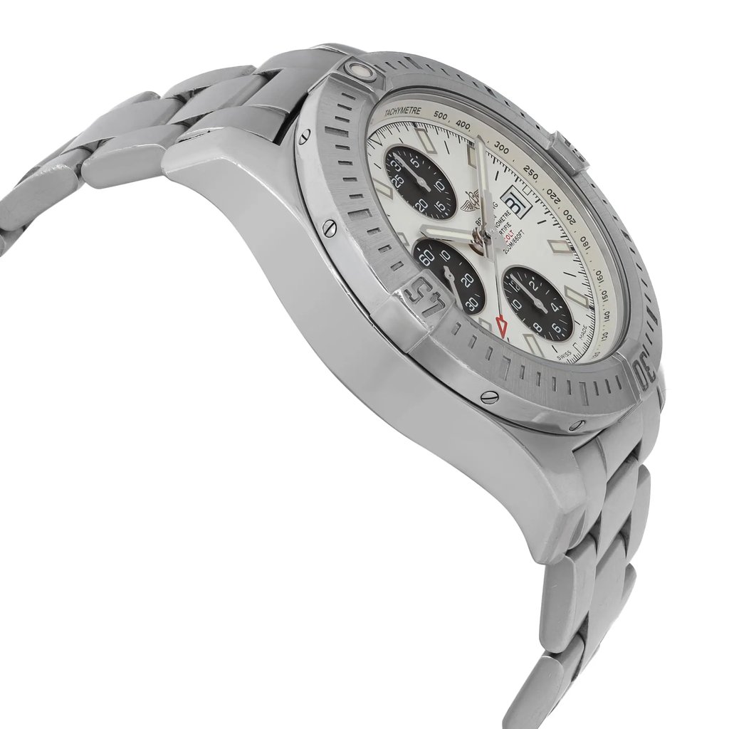 An image of a pre-owned wristwatch taken from a side profile view, opposite the crown. The watch features a metallic band and a detailed face with multiple sub-dials. The angle highlights the curvature of the band and the thickness of the case. The image is captured at a medium distance, showcasing the watch's intricate design and craftsmanship.