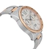 An image of a pre-owned Cartier men's wristwatch, showcasing its side angle from a close-up perspective. The watch features a stainless steel case with a rose gold bezel. The dial displays Roman numerals, a chronograph, a date indicator, and luminous hands. The two-tone bracelet is visible, highlighting its blend of stainless steel and rose gold links.