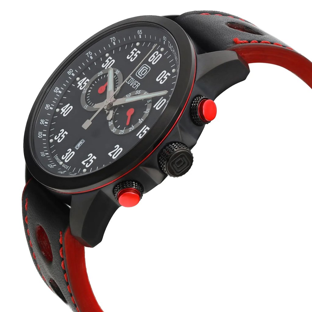 An image of a men's COVER wristwatch taken from a slightly elevated angle, showcasing the side profile and face of the watch. The watch features a black case with red accents, visible chronograph buttons, and a black strap with red stitching. The dial displays a chronograph, date indicator, and small seconds subdial, with luminous hands for enhanced visibility. The angle highlights the watch's sporty design and detailed features.
