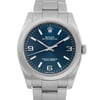 An image of a pre-owned wristwatch, featuring a front close-up shot of the watch face. The watch has a sleek metal band and a deep blue dial with silver hour markers and hands. The brand logo is visible at the top of the dial, with additional text indicating its certification. The crown is positioned on the right side of the case. The angle captures the watch face directly, highlighting its elegant design.