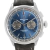 An image of a front close-up shot of a Breitling men's wristwatch, showcasing a round blue sunburst dial with stick indexes, two subdials, and a date window at the 6 o'clock position. The watch has a stainless steel case with a steel bezel, and is attached to a leather band. The watch is positioned directly facing the camera, allowing clear visibility of the dial details and brand logo. The image is taken from a close distance, capturing the entire watch face and part of the leather strap. The watch is a display model and has never been worn, there may be minor blemishes on the band due to store handling.