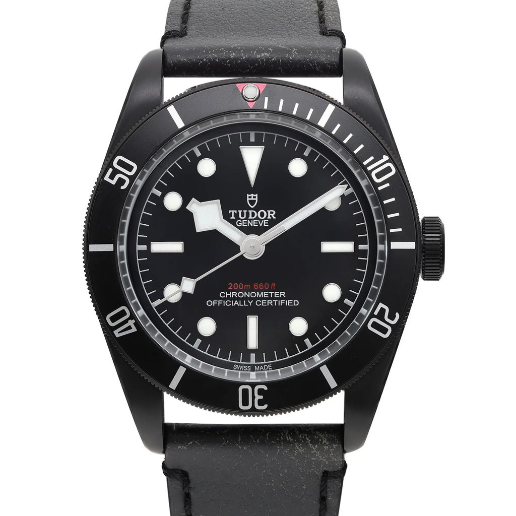 An image of a wristwatch taken from a front close-up angle, showcasing the watch face prominently. The display model features a black dial with white hour markers and hands, encased in a black bezel. The watch strap is also visible, made of black material. The text on the dial indicates it's a chronometer and officially certified.