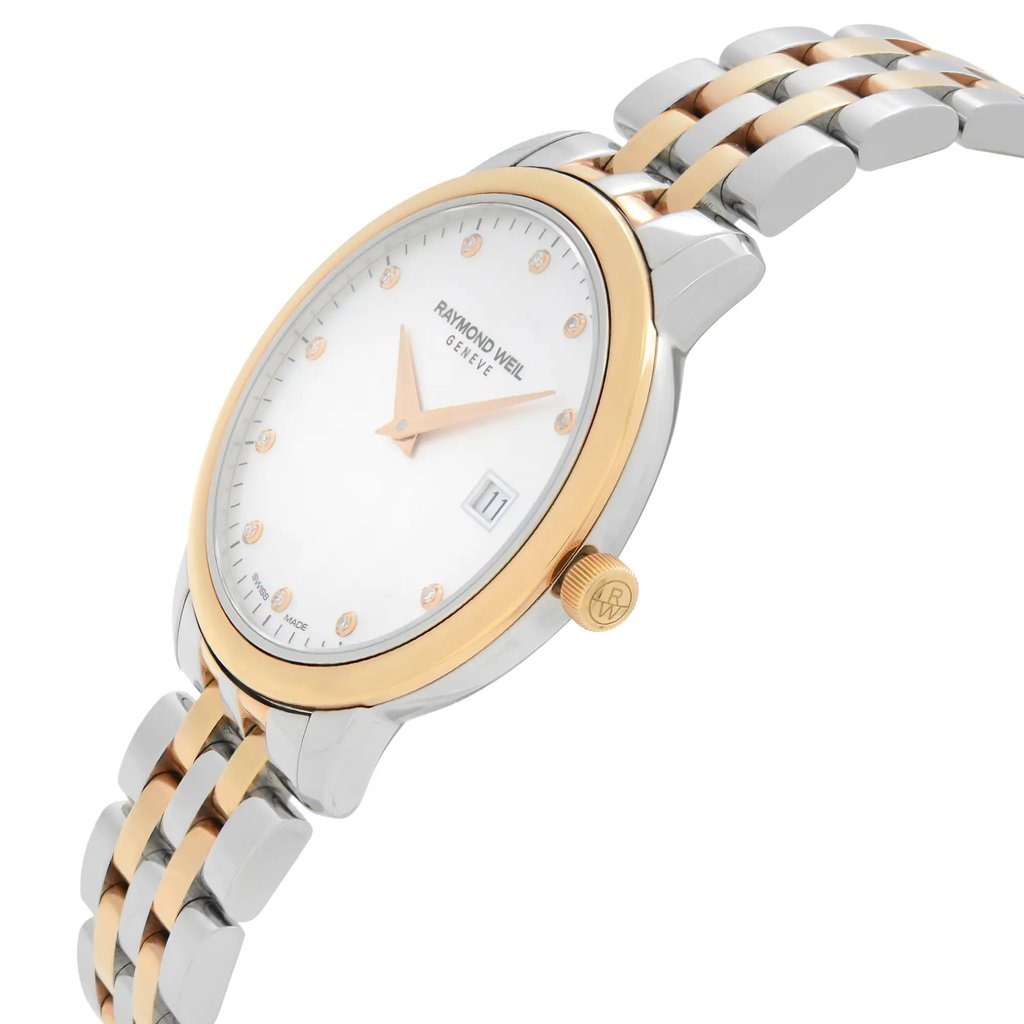 An image of an unworn RAYMOND WEIL women's dress/formal wristwatch with a side profile view showing the crown. The watch features a round, two-tone case in stainless steel and rose gold electroplated finish. The dial is silver with gold-tone markers and hands, and the date is displayed at the 3 o'clock position. The stainless steel band also has a two-tone design matching the case. The watch is presented in a close-up angle that highlights the side of the case and the texture of the bracelet links.