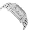 An image of a pre-owned wristwatch shown from a side profile view, opposite the crown. The watch features a polished metal bracelet and a rectangular face with Roman numerals. The angle highlights the sleek design and curvature of the case. The shot is taken from a close distance, emphasizing the watch's elegant details.